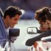 Young man in a car and young woman in a convertible --- Image by © Targa/Corbis